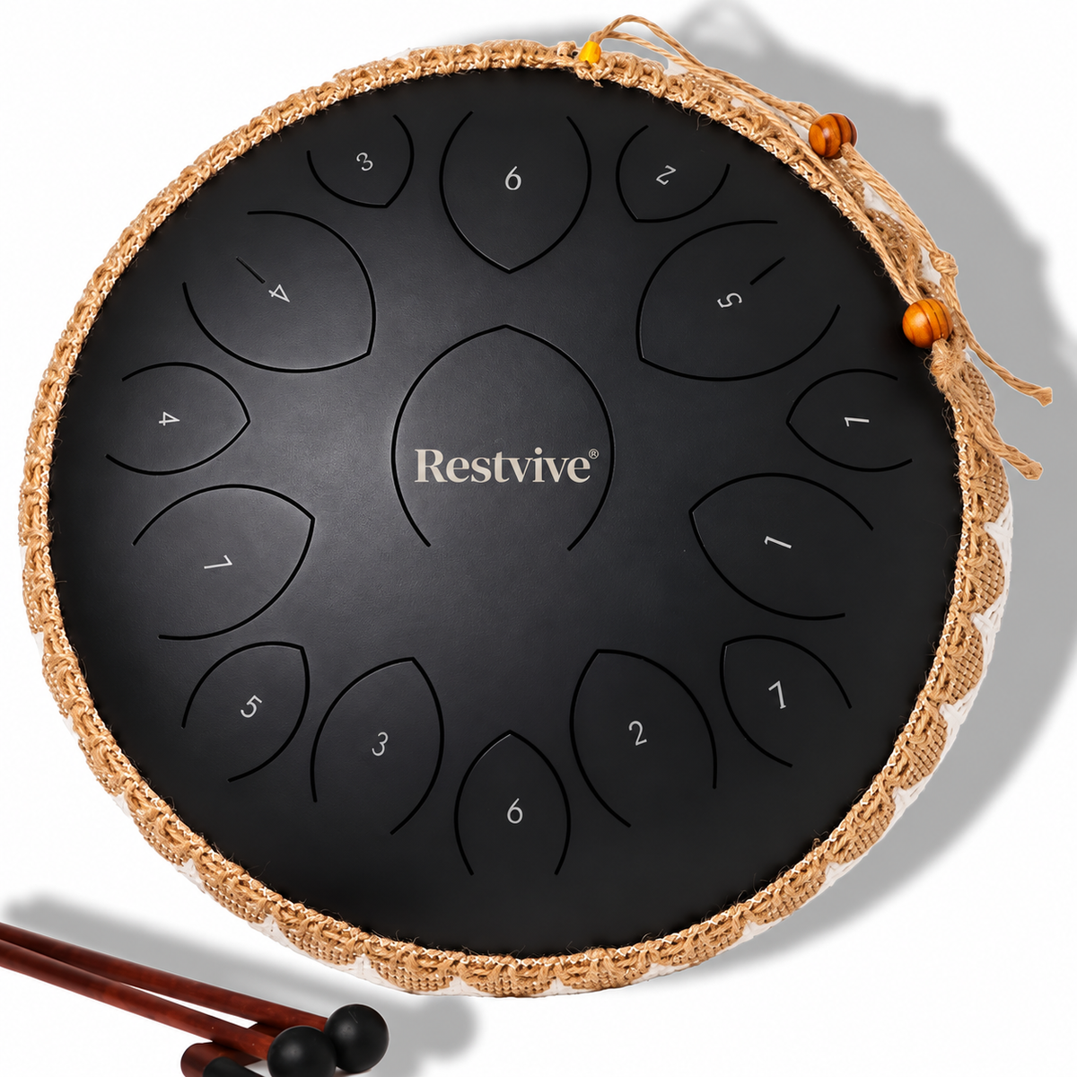 Top view of the black Restvive Serenity Steel Tongue Drum with eleven numbered tongues and a pair of mallets